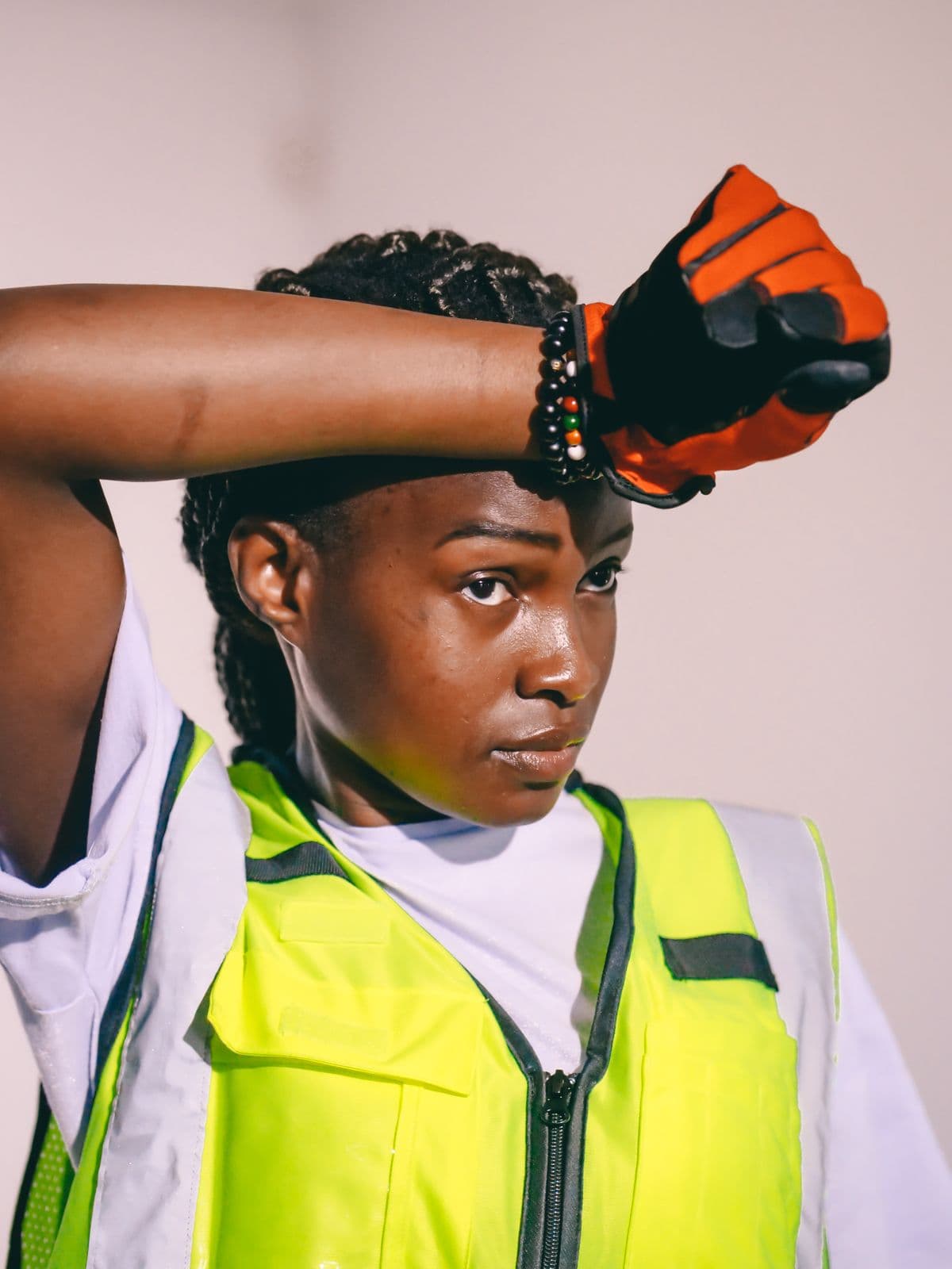 Engineer wearing a reflective safety vest and protective gloves on site