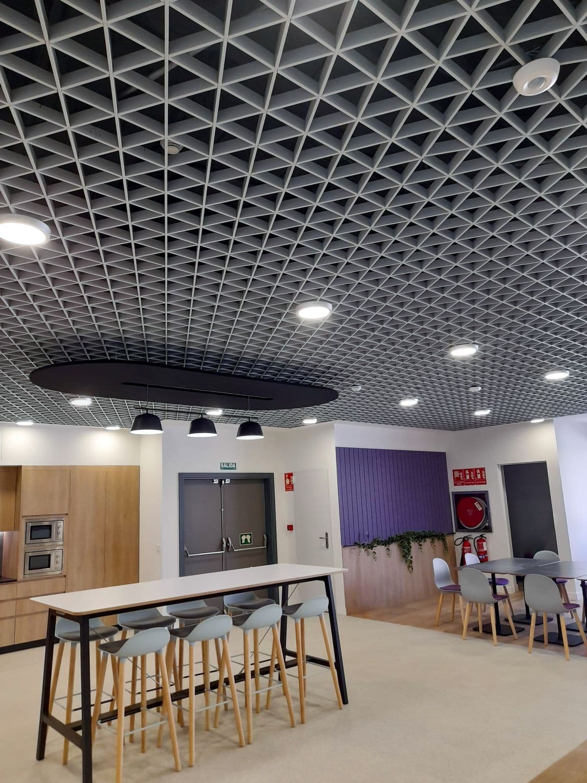 Modern office space featuring a unique ceiling design