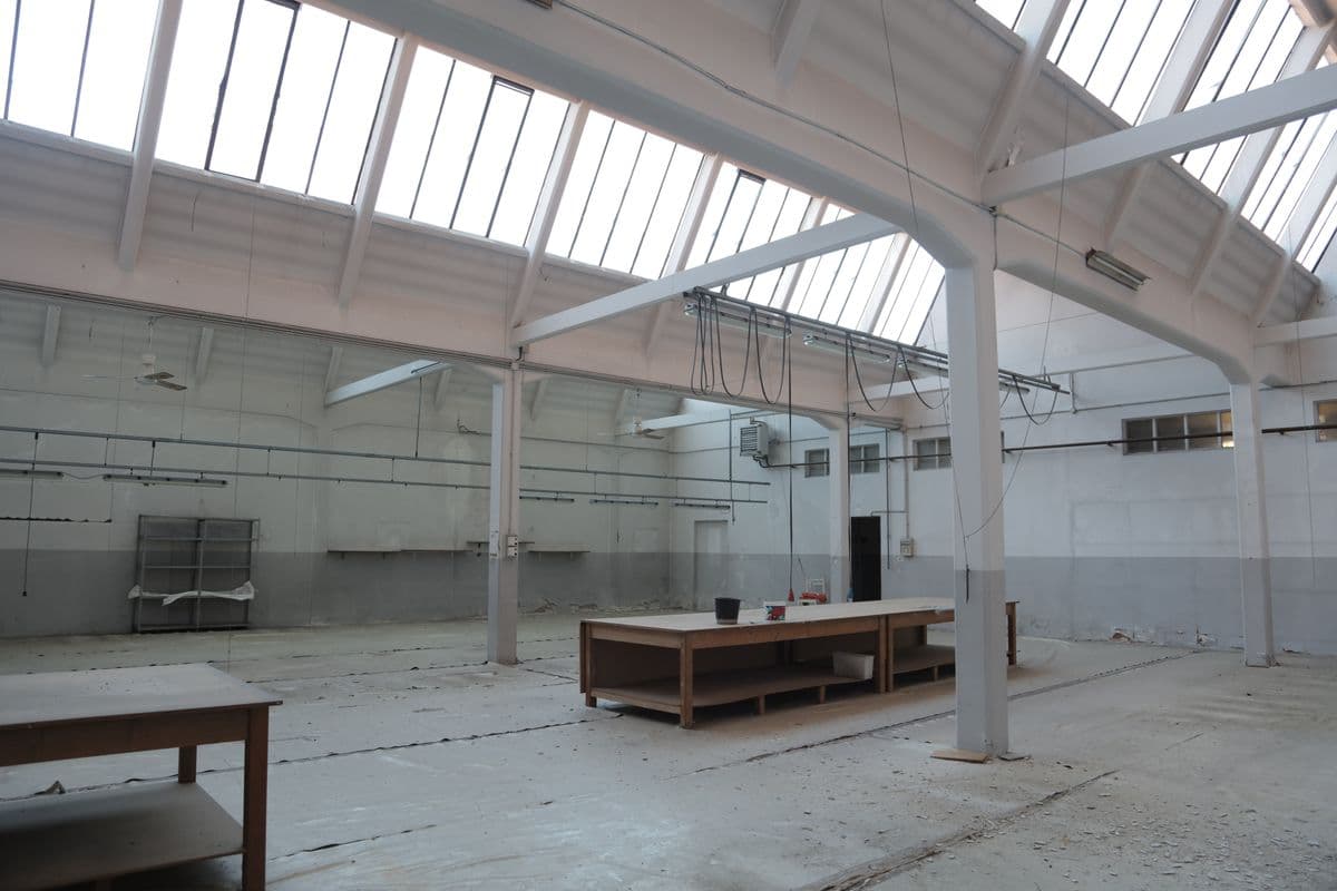 Spacious modern warehouse interior used for storing construction materials and supplies